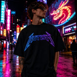 Autism neon graphic black T-shirt in colourful night street setting