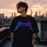 Male model wearing autism neon graphic black T-shirt at sunset