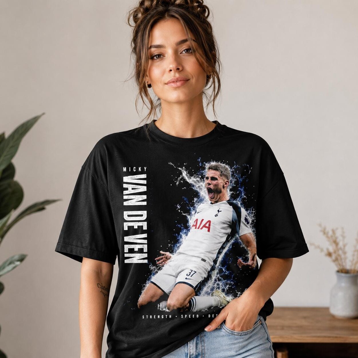Woman wearing Micky van de Ven inspired black Tottenham fan T-shirt