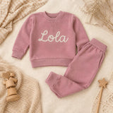 Soft pink personalised baby tracksuit flat lay