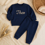 Navy personalised baby tracksuit flat lay