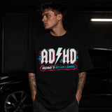 Printora UK black cotton t-shirt with neon pink and turquoise ADHD Highway to Hey Look a Squirrel graphic on a model