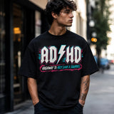 Printora UK black unisex cotton t-shirt with neon ADHD Highway to Hey Look a Squirrel graphic worn by a young man