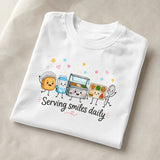 Printora UK white heavyweight cotton t-shirt featuring a cute cartoon school lunch graphic and Serving Smiles Daily text