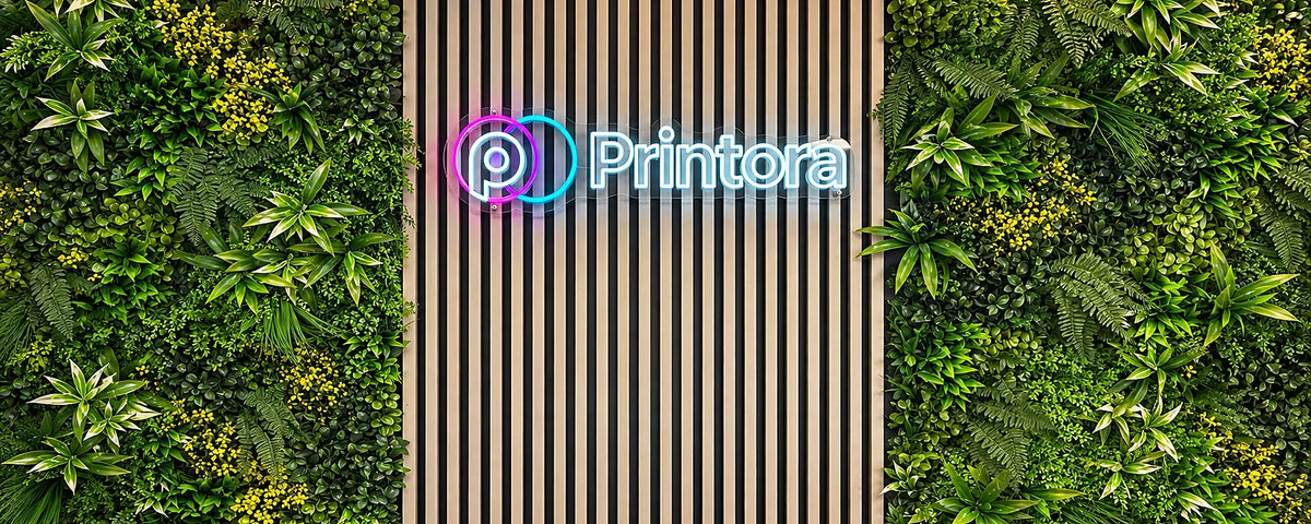 Printora studio wall in Coleshill with illuminated Printora sign and green feature wall