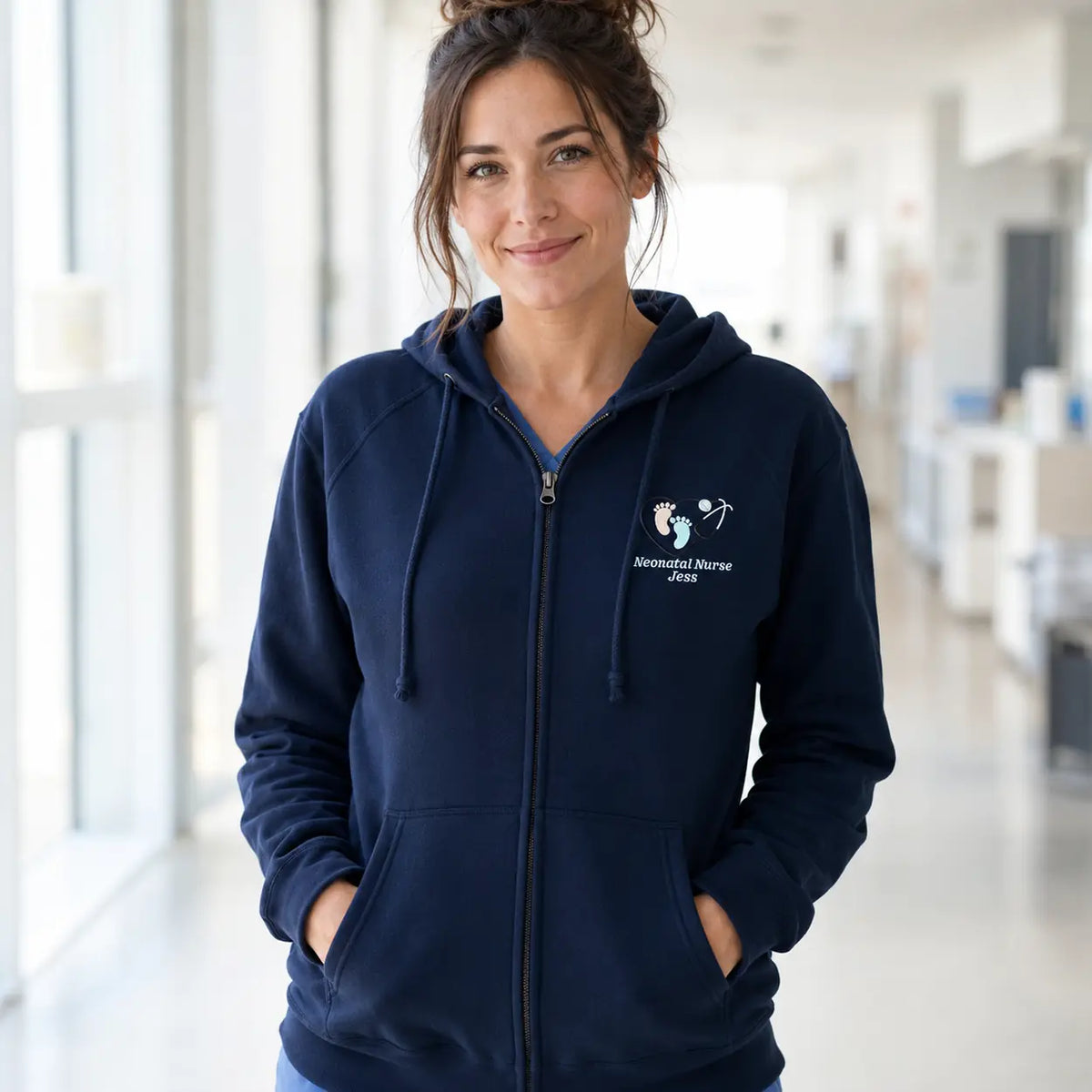 Model wearing navy NHS Neonatal Nurse footprint embroidered hoodie