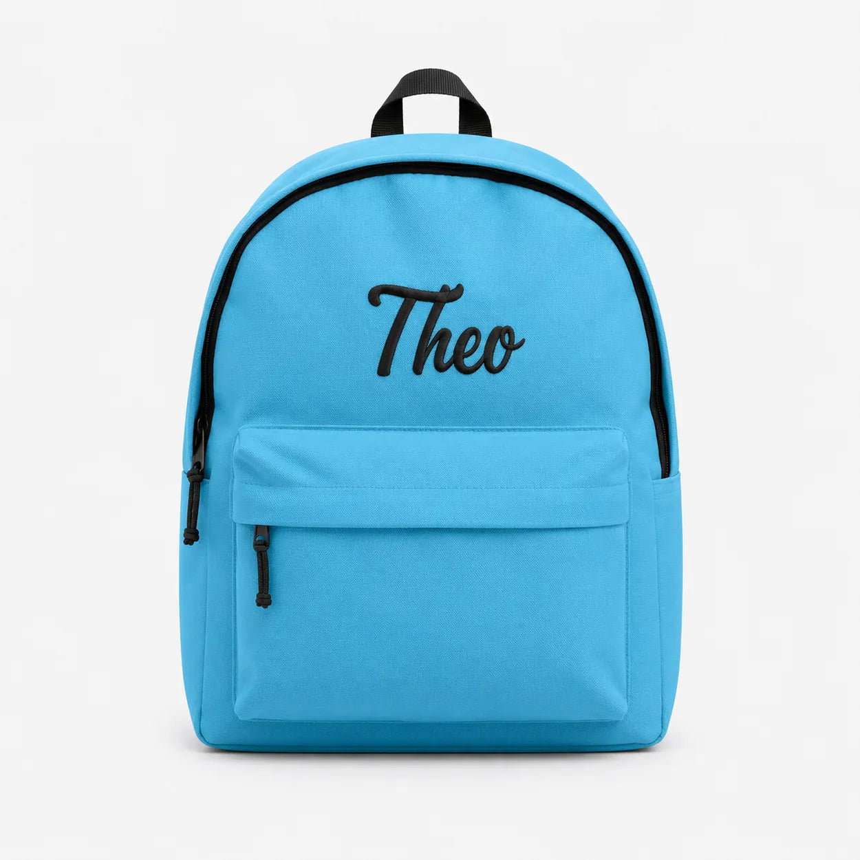 A bright blue backpack with black trim, a top handle, a front zippered pocket, and the name 'Theo' embroidered in black script on the front, shown against a plain white background.
