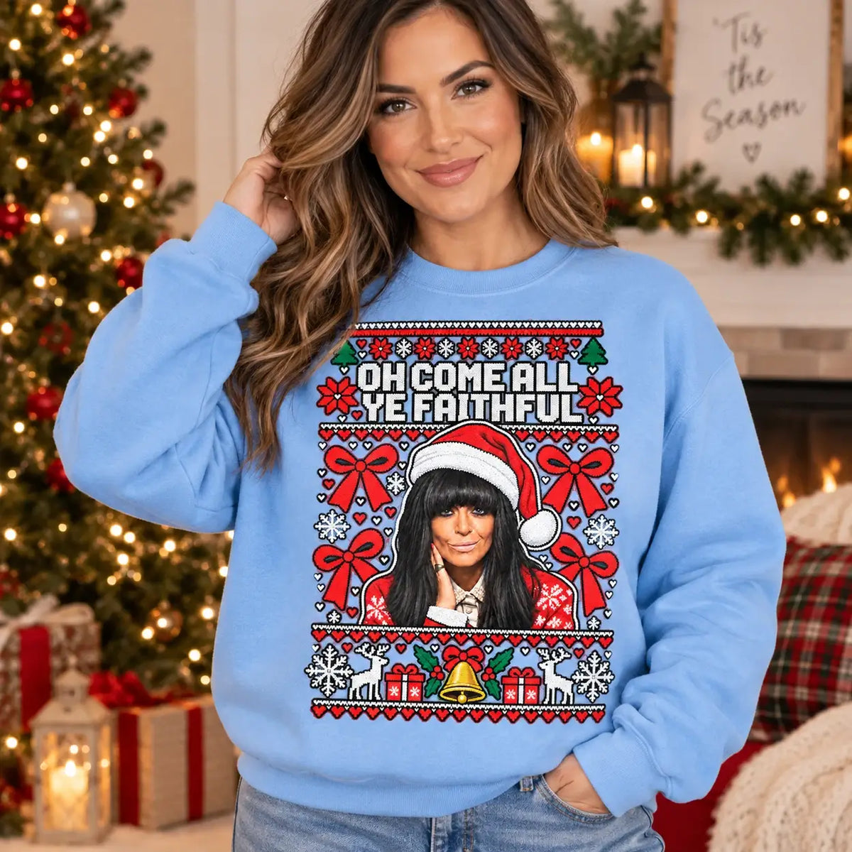 Model wearing sky blue Faithful Christmas jumper with Claudia Winkleman inspired design