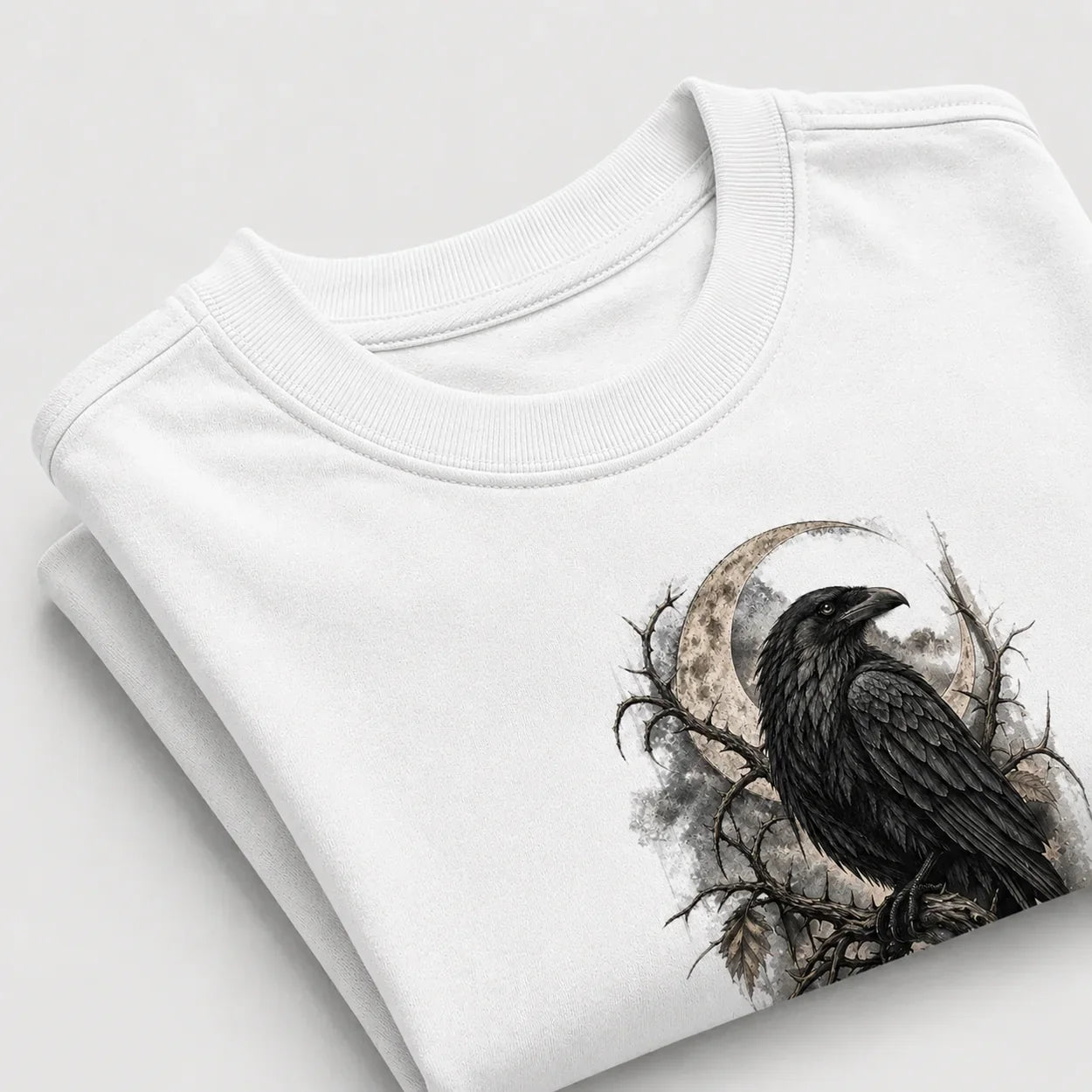 Gothic Raven Moon graphic T-shirt folded mockup - Arctic White