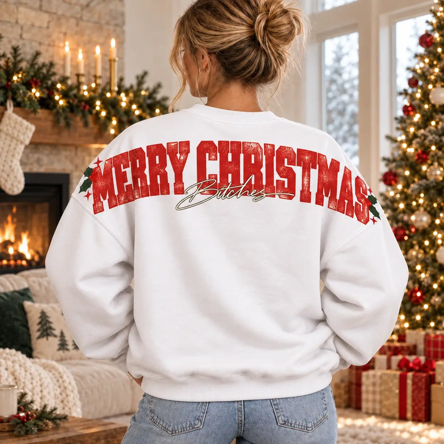 Woman wearing white Merry Christmas Bitches Christmas sweatshirt, wide distressed red rear shoulder print