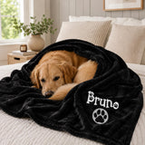 Soft embroidered pet blanket shown on a pet bed