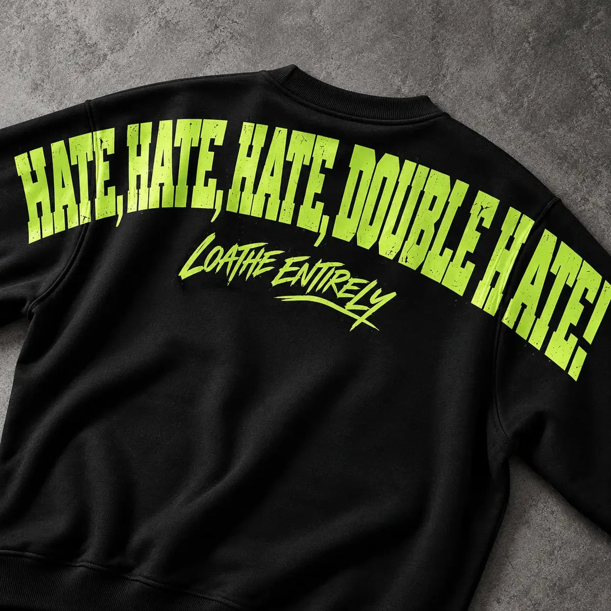 Christmas jumper Back Print Closeup: optional fluffy festive green Santa-hat chest embroidery and large lime Hate Hate Hate Loathe Entirely back print, Printora UK