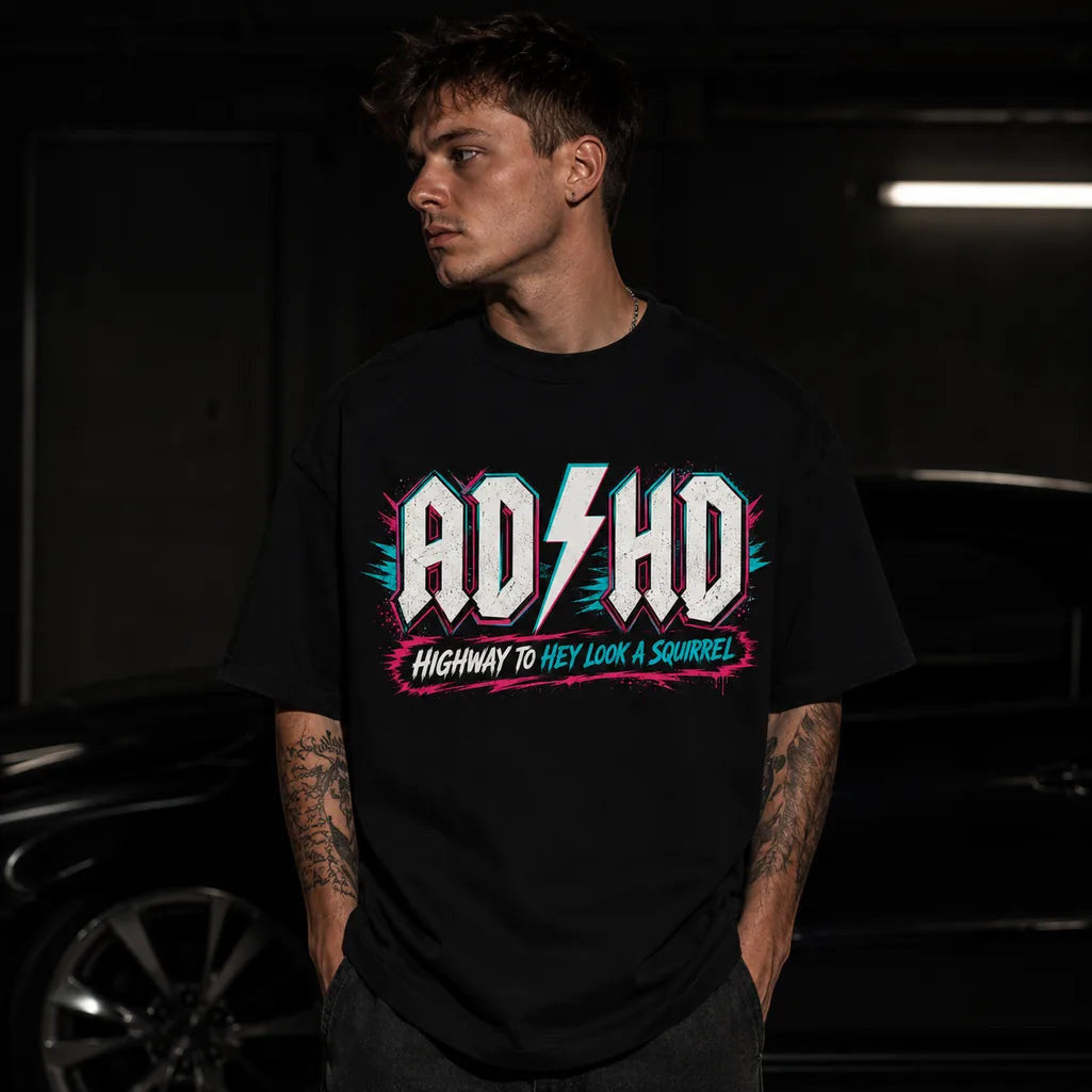 Printora UK black cotton t-shirt with neon pink and turquoise ADHD Highway to Hey Look a Squirrel graphic on a model