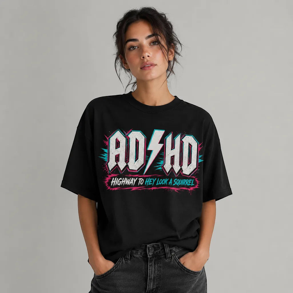 Printora UK black cotton t-shirt with neon pink and turquoise ADHD Highway to Hey Look a Squirrel graphic print