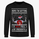 Printora UK black Christmas jumper featuring Bukayo Saka in a Santa hat with festive football-themed text and patterns.