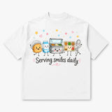 Printora UK white heavyweight cotton t-shirt featuring a cute cartoon school lunch graphic and Serving Smiles Daily text