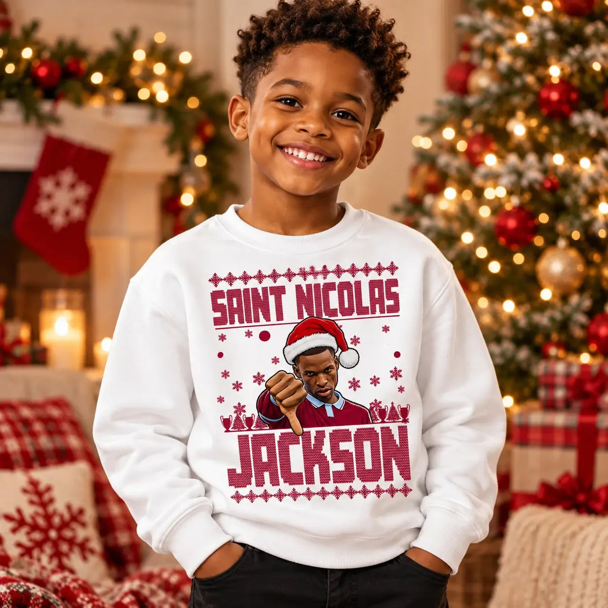 Boy wearing white Saint Nicolas Jackson Christmas jumper