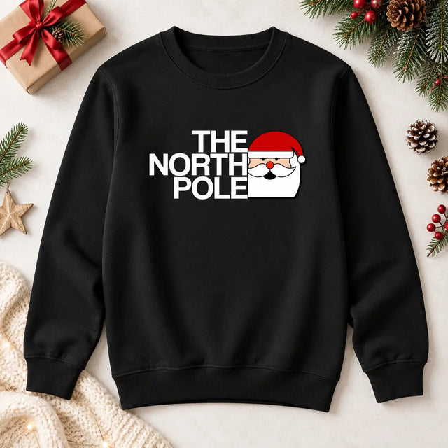 Black The North Pole Santa Christmas jumper flat lay