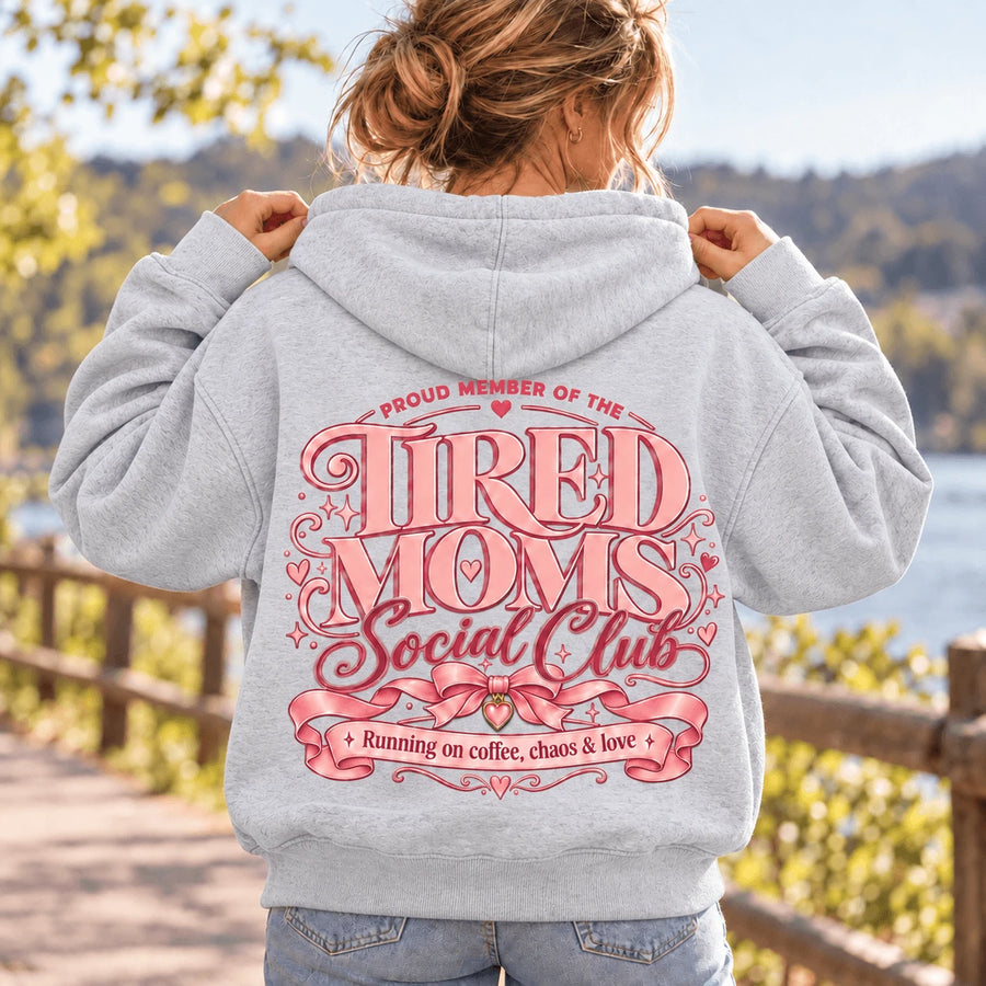 Tired Moms Social Club Heather Grey hoodie model wearing light Heather Grey hoodie showing full back graphic – Printora UK
