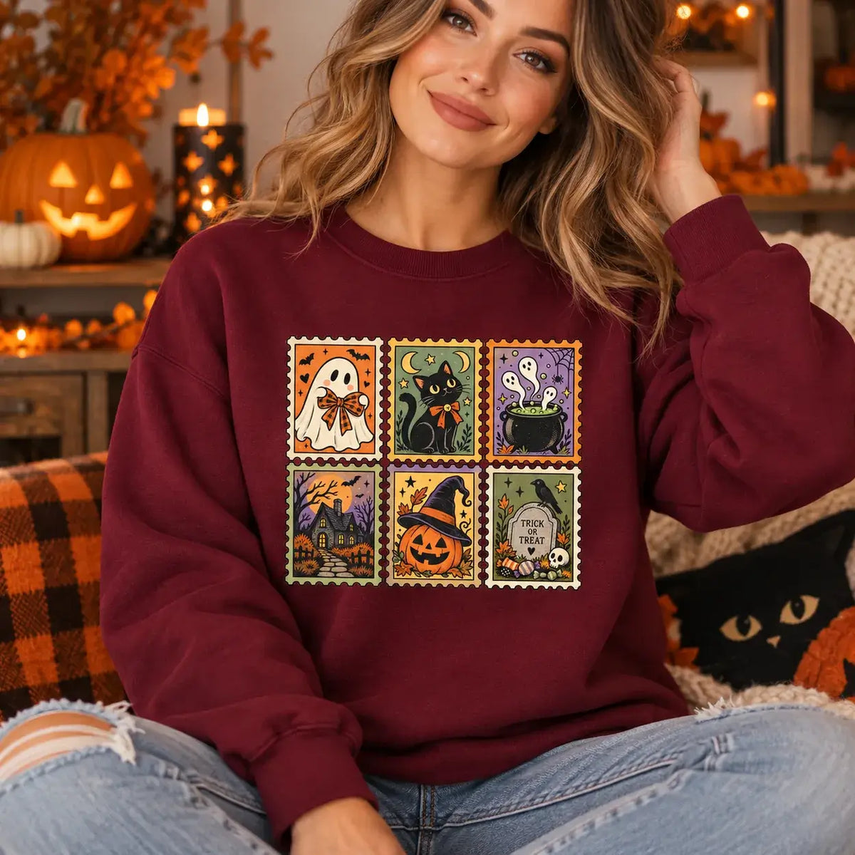 Woman wearing burgundy vintage Halloween postage stamp jumper